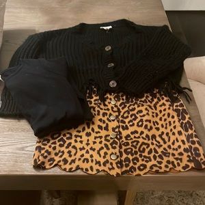 Set with long sleeve shirt, sweater, and skirt.